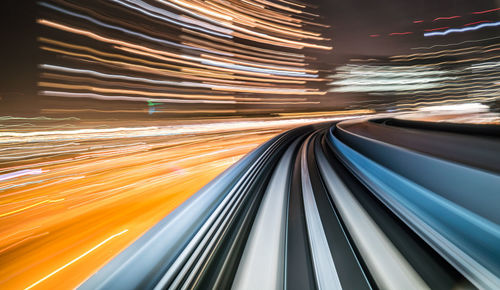 Light trails on railroad track at night