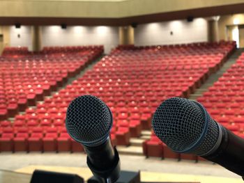 Close-up of microphone in auditorium