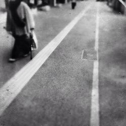 Woman standing on road