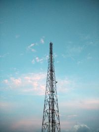 Low angle view of communications tower against sky