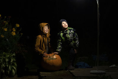 Young couple standing at night