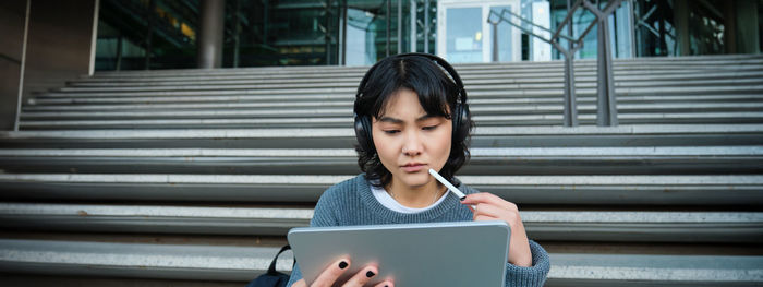 Young woman using mobile phone