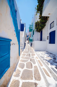 Empty alley amidst buildings in city