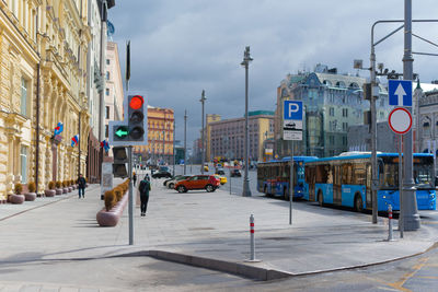 Street lights in city against sky