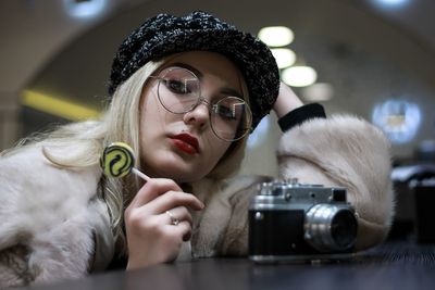 Portrait of woman photographing