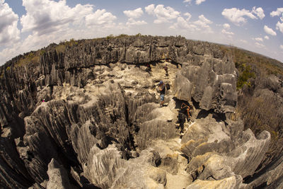 Rock formations on landscape against sky