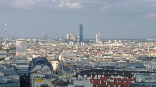 High angle view of buildings in city against sky