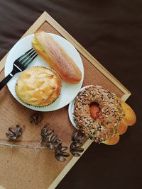 Freshly baked multi grain bagels,durian pastry with custard cream eclair for breakfast.