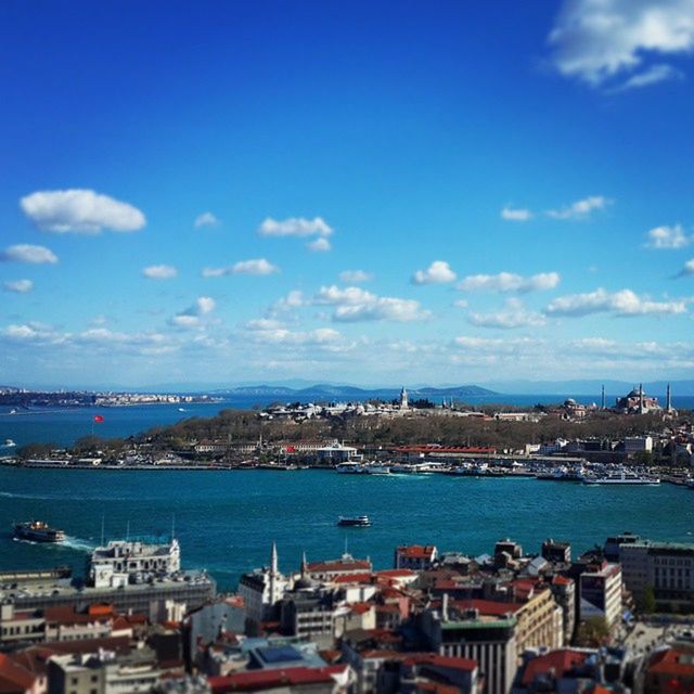 architecture, built structure, building exterior, water, sea, city, blue, cityscape, sky, nautical vessel, crowded, high angle view, residential district, harbor, residential structure, river, residential building, transportation, cloud - sky, town