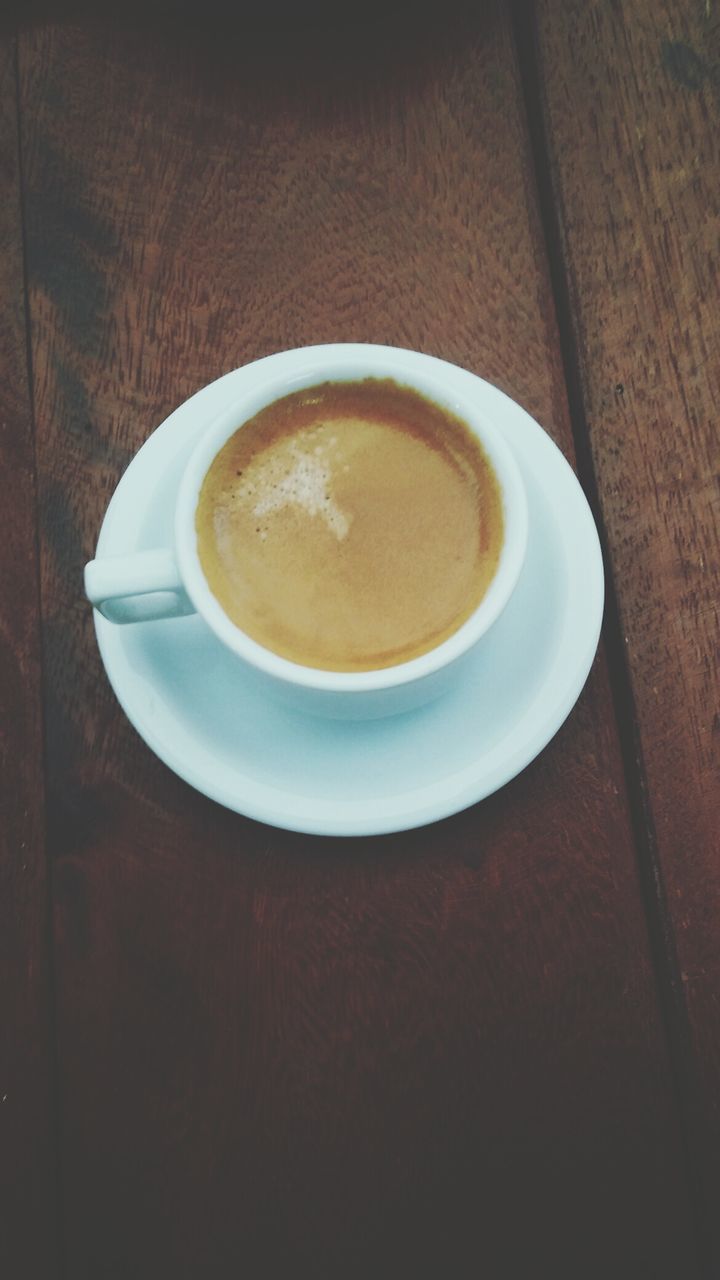 coffee cup, drink, food and drink, refreshment, indoors, coffee - drink, table, saucer, coffee, freshness, still life, cup, close-up, frothy drink, high angle view, cappuccino, directly above, beverage, no people, brown