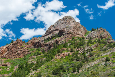 Low angle view of rocks against sky