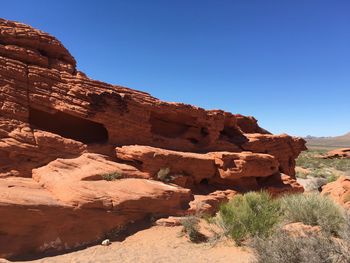 Scenic view of landscape against clear blue sky