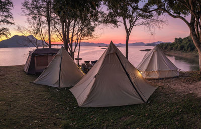 Tent against sky during sunset
