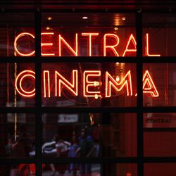 Illuminated text on window at night