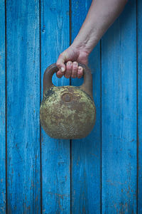 Close-up of human hand holding kettlebell