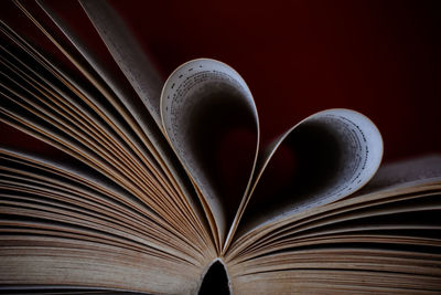 Close-up of heart shape on book