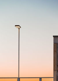 Low angle view of street light against sky