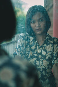 Portrait of a young woman looking away