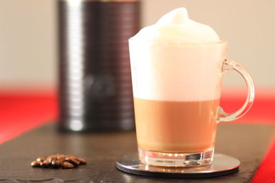 Close-up of coffee cup on table
