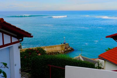 High angle view of building by sea against sky