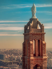 Statue of a building at sunset