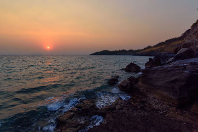 Scenic view of sea against sky during sunset