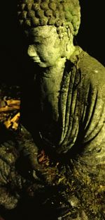 Close-up of human hand over black background