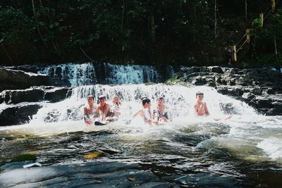 Group of people splashing water