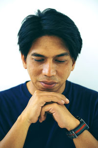 Portrait of a man bowing to prayer