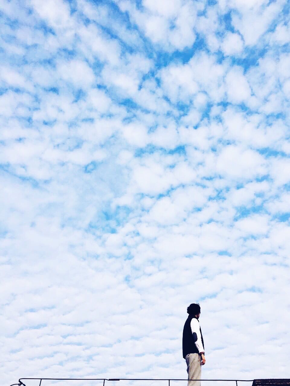 lifestyles, leisure activity, sky, men, cloud - sky, standing, rear view, full length, casual clothing, low angle view, walking, cloud, person, outdoors, day, side view, three quarter length