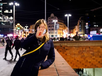 Woman has drawn a sign lightning oh hand. women protest against abortion in poland.