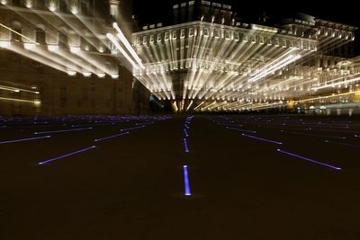 Street lights in illuminated city at night