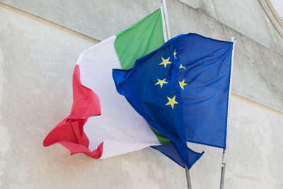 Flag against blue wall