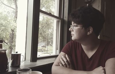 Boy sitting in window