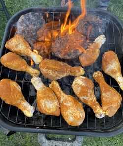 High angle view of meat on barbecue grill