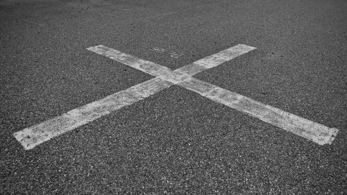 High angle view of arrow symbol on road