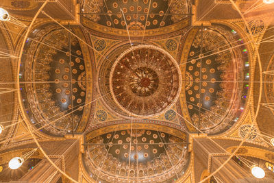 Low angle view of illuminated ceiling of building