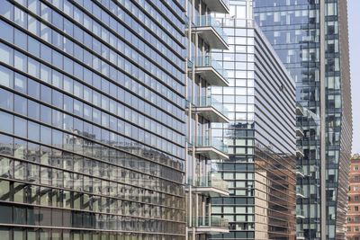 Low angle view of modern buildings in city