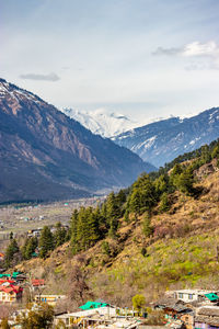 Scenic view of snowcapped mountains against sky