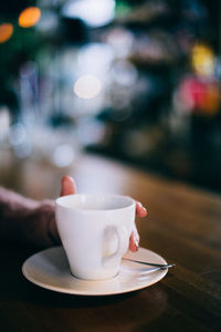 Close-up of coffee cup on table