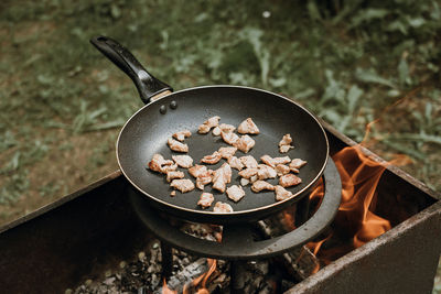 High angle view of meat in cooking pan