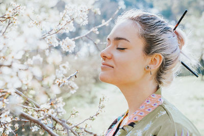 Portrait of young woman looking at camera