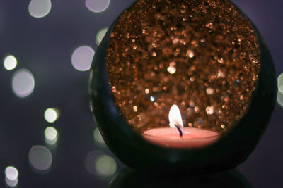 High angle view of burning candle