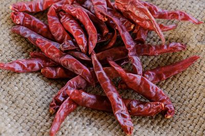 High angle view of red chili peppers on table