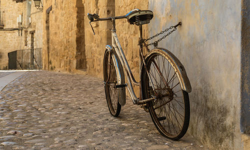 Bicycle leaning against wall