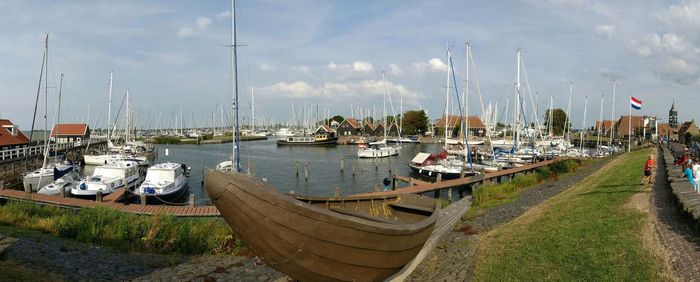 Boats moored at harbor