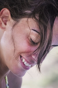 Close-up portrait of a smiling young woman