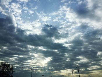 Low angle view of electricity pylon against sky
