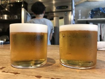 Close-up of beer glass on table