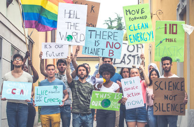 People with banners protesting on street